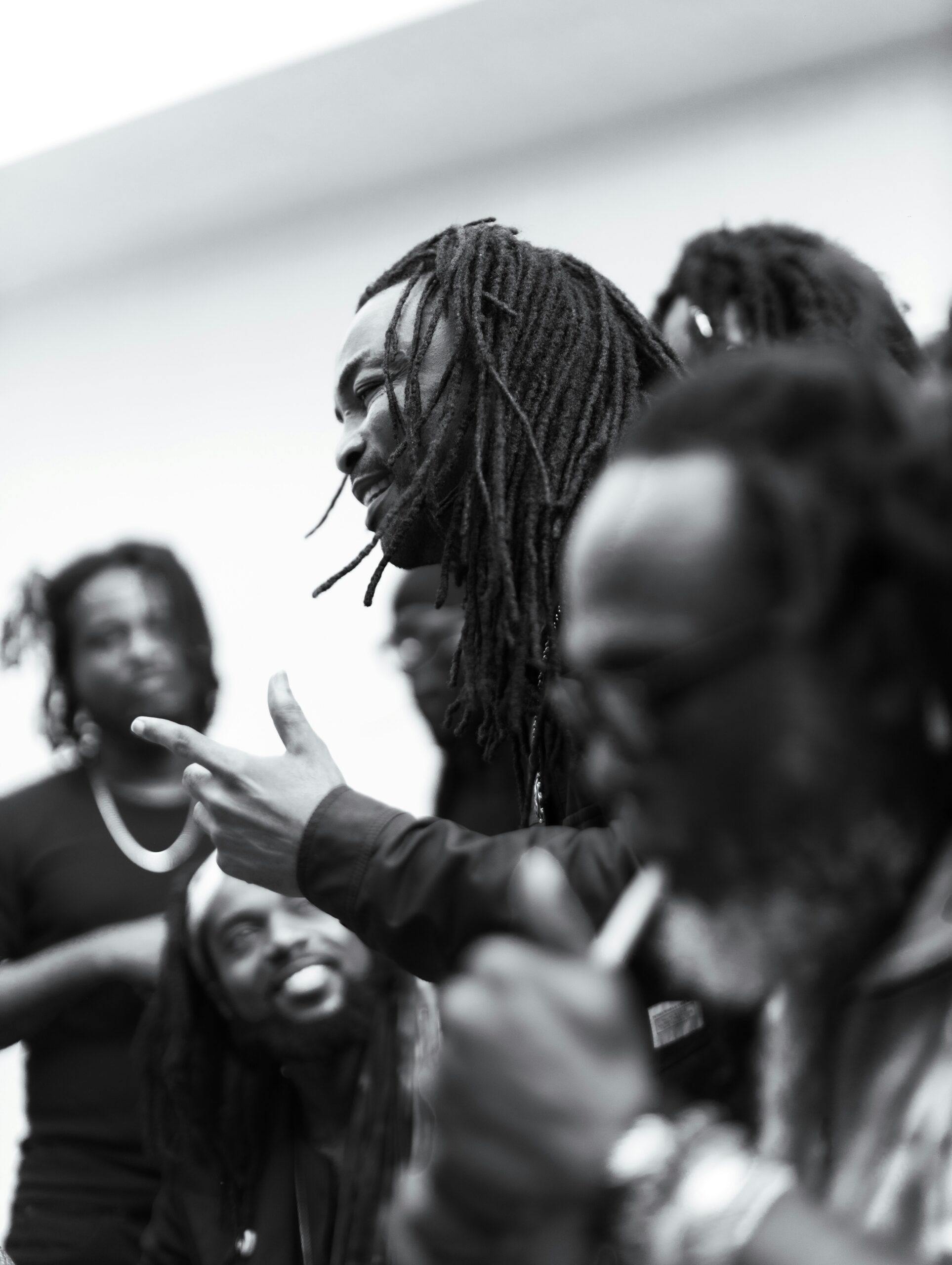 Black men speaking together in a thoughtful community setting